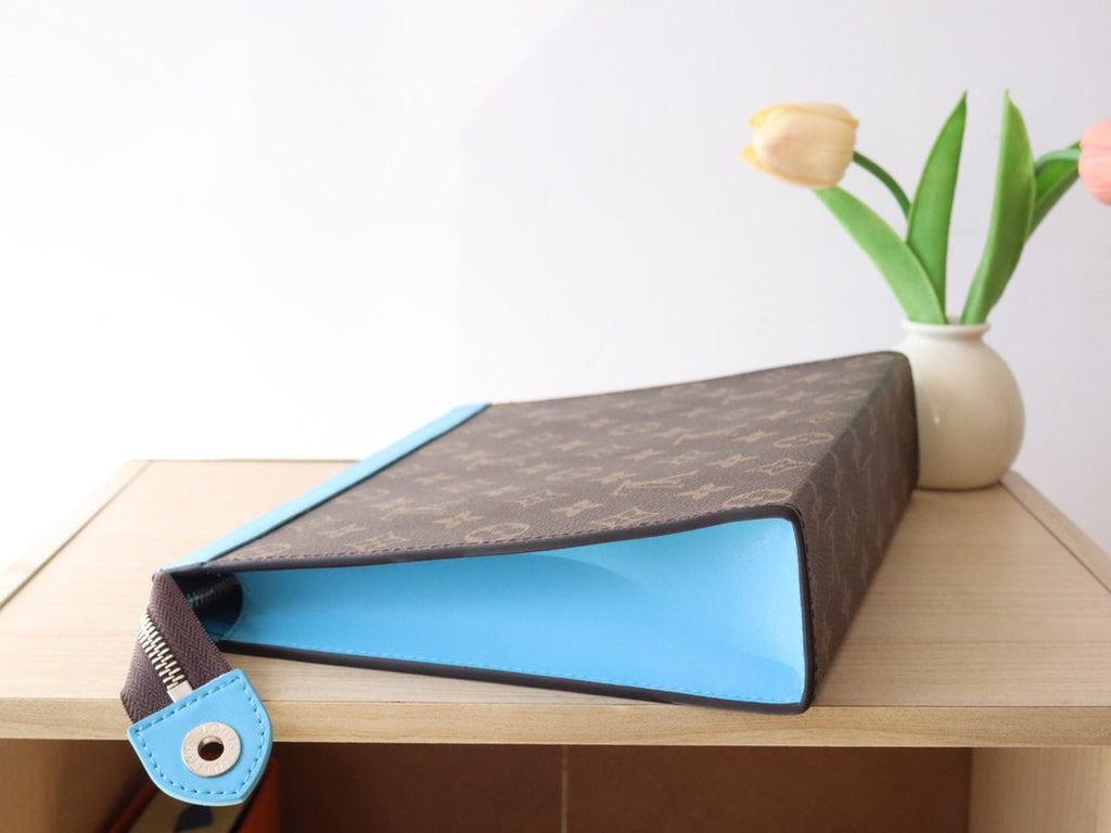 LOUIS VUITTON LV 25S POCHETTE VOYAGE 26 IN GASTON BLUE MONOGRAM MACASSAR COATED CANVAS